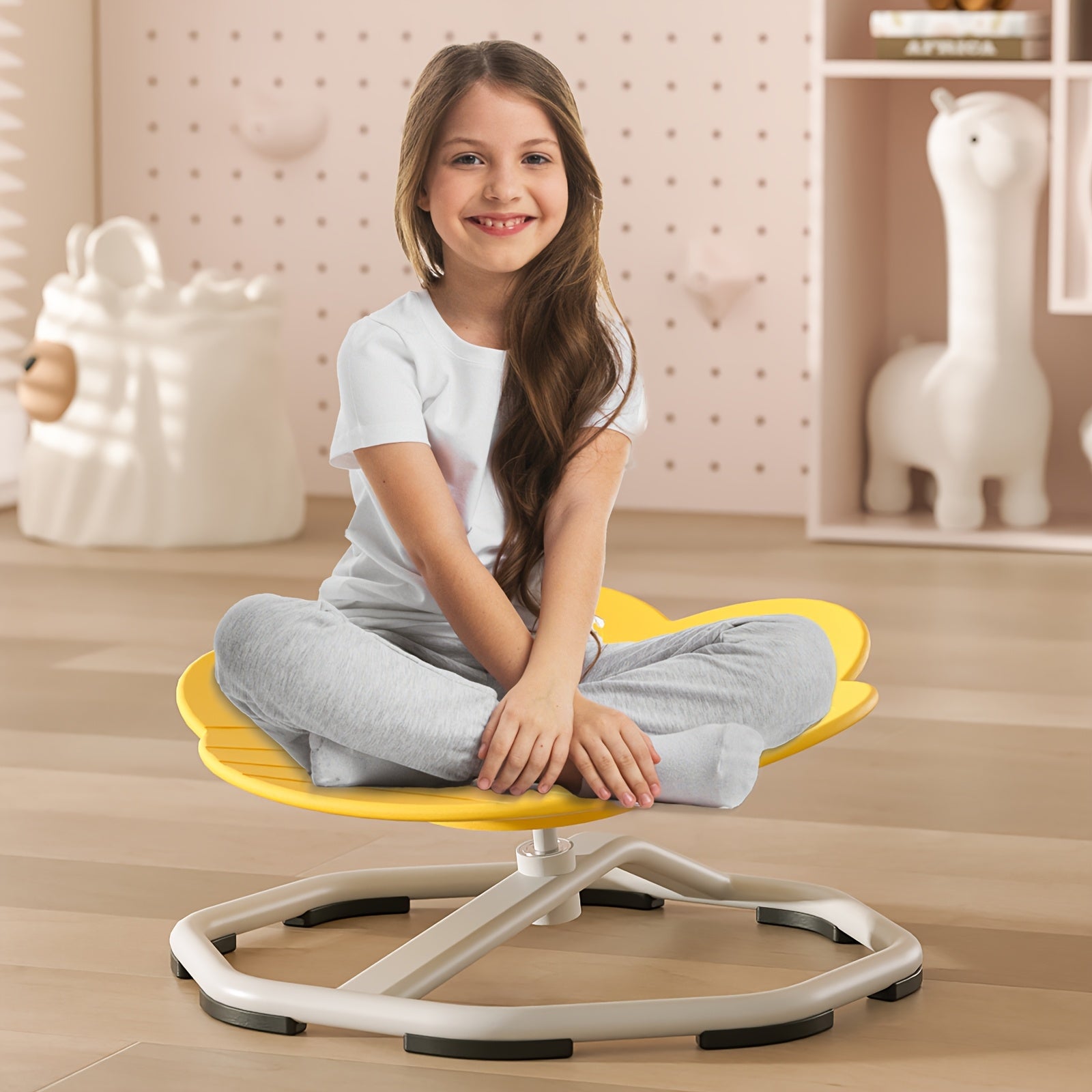 Children's red spinning chair made of durable plastic and metal, enhances coordination and focus, promotes body movement.