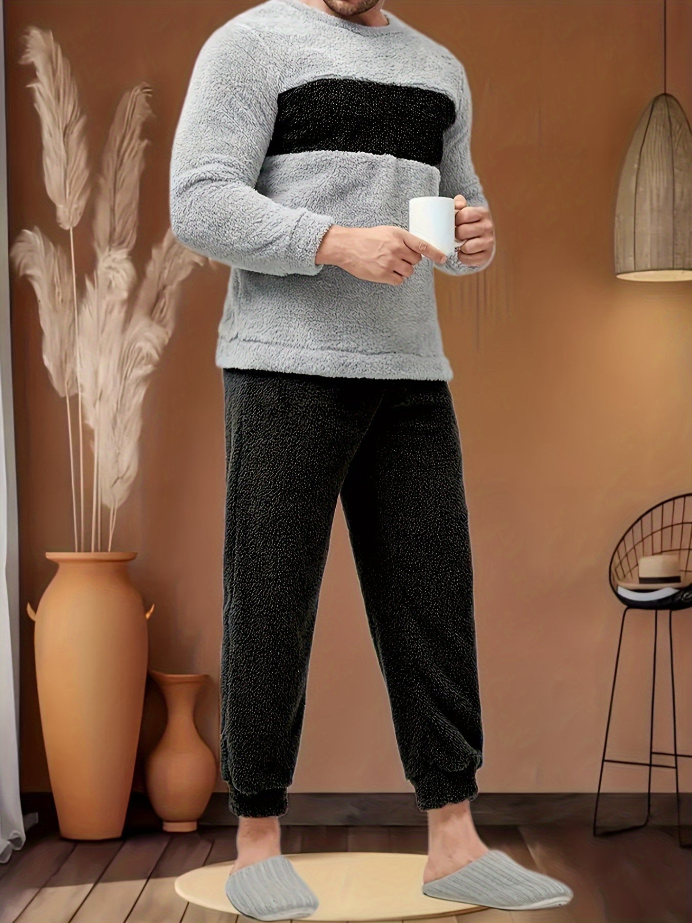 Men's cozy winter flannel pajama set with drawstring, loose fit, and round neck. Made from polyester knit fabric for casual home wear.