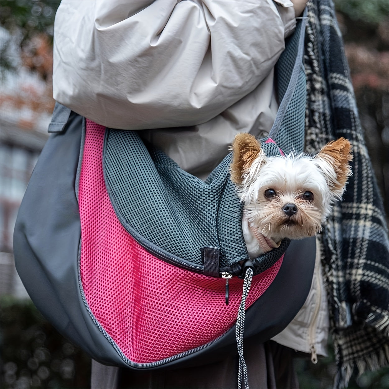 Zippered dog sling carrier for travel with breathable mesh, perfect for outdoor adventures with your puppy or cat.