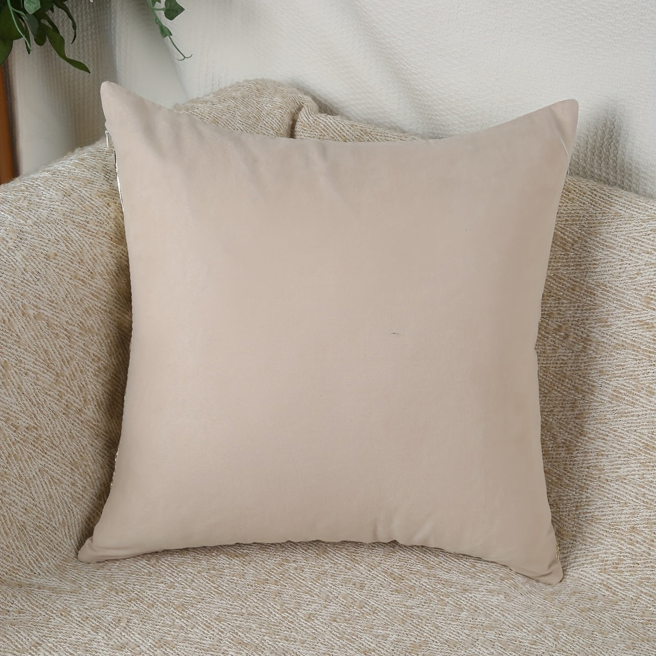 A 17.7-inch square cushion cover.