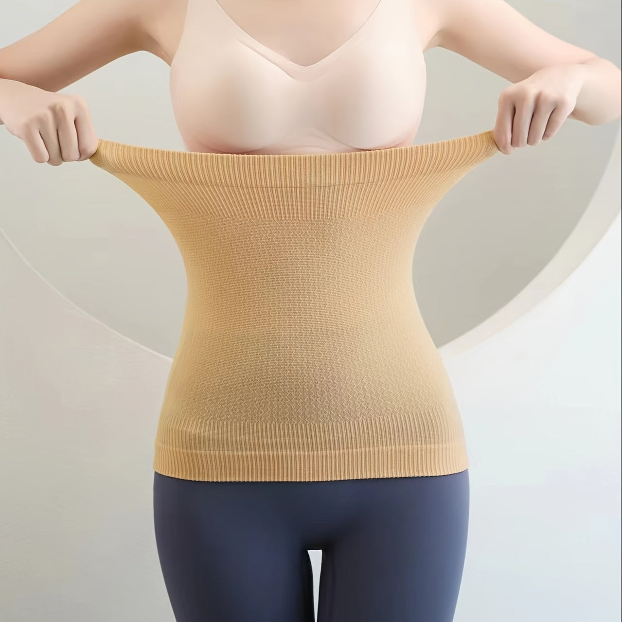 Women's Postpartum Waist Trainer made of 92% Polyamide and 8% Elastane fabric, with light control for tummy slimming. Hand washable with pull-on closure.