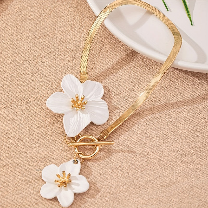 Stylish gold-tone anklet with white flower charms, perfect for vacations and everyday wear.