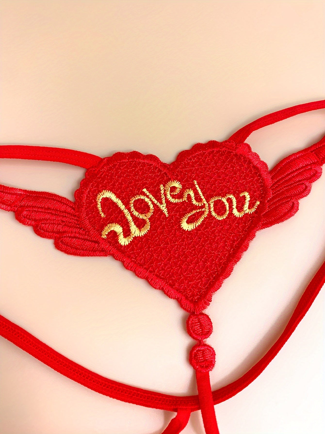 3 Elegant heart chain thongs with 'LOVE YOU' embroidery, perfect for Valentine's Day. Made from soft polyester and spandex blend.