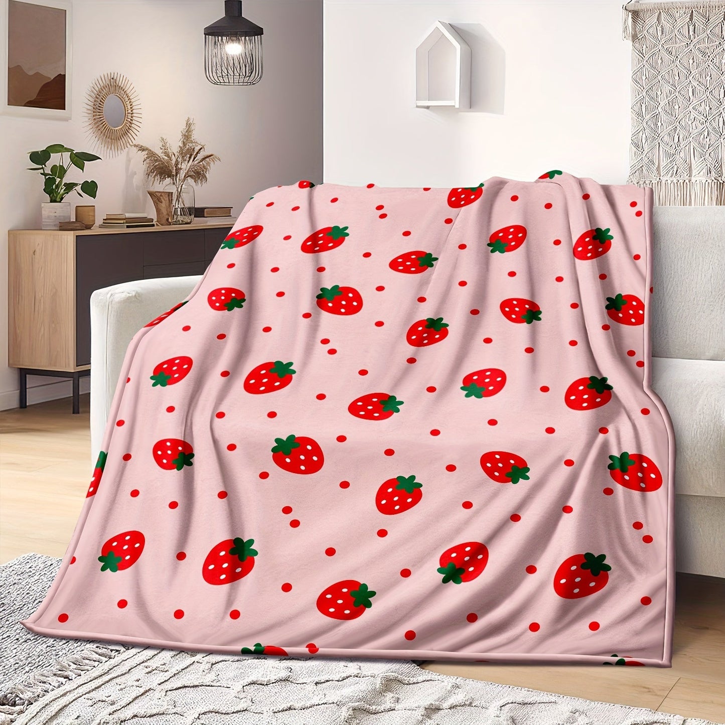 One piece of a strawberry printed throw blanket, perfect for bed, sofa, office, camping, or traveling. This soft and cozy blanket is versatile and makes a great gift for all seasons.