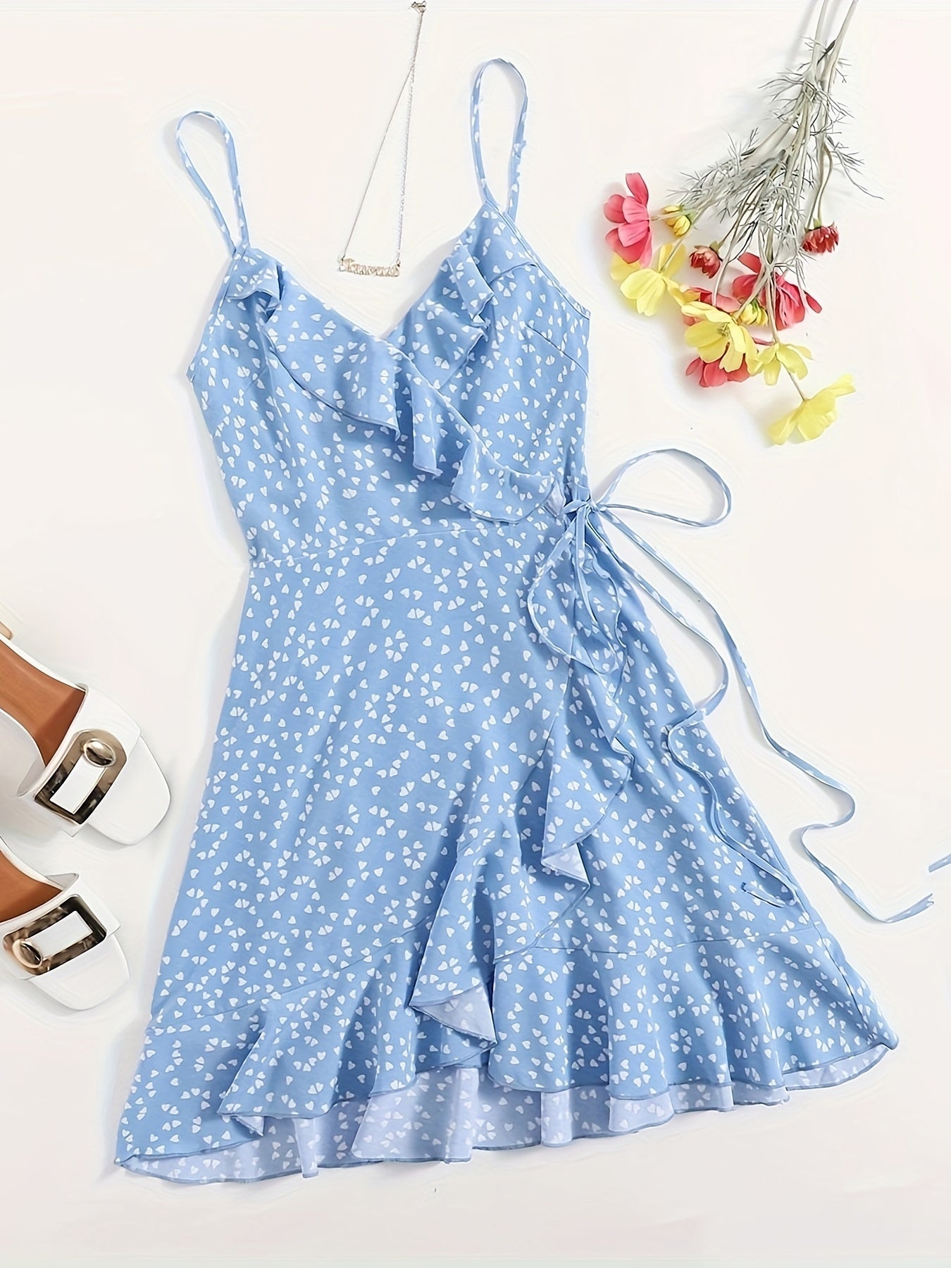 Heart print ruffle cami dress with lace-up detail, sleeveless V-neck design, perfect for spring and summer.