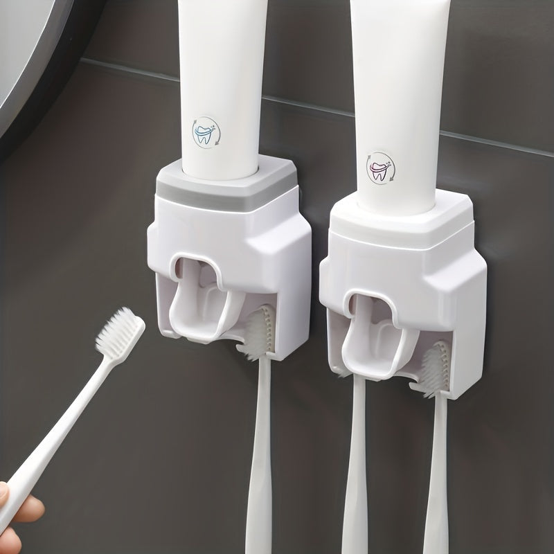 Wall mounted toothbrush holder and toothpaste dispenser with automatic squeezer, ideal for family washroom.