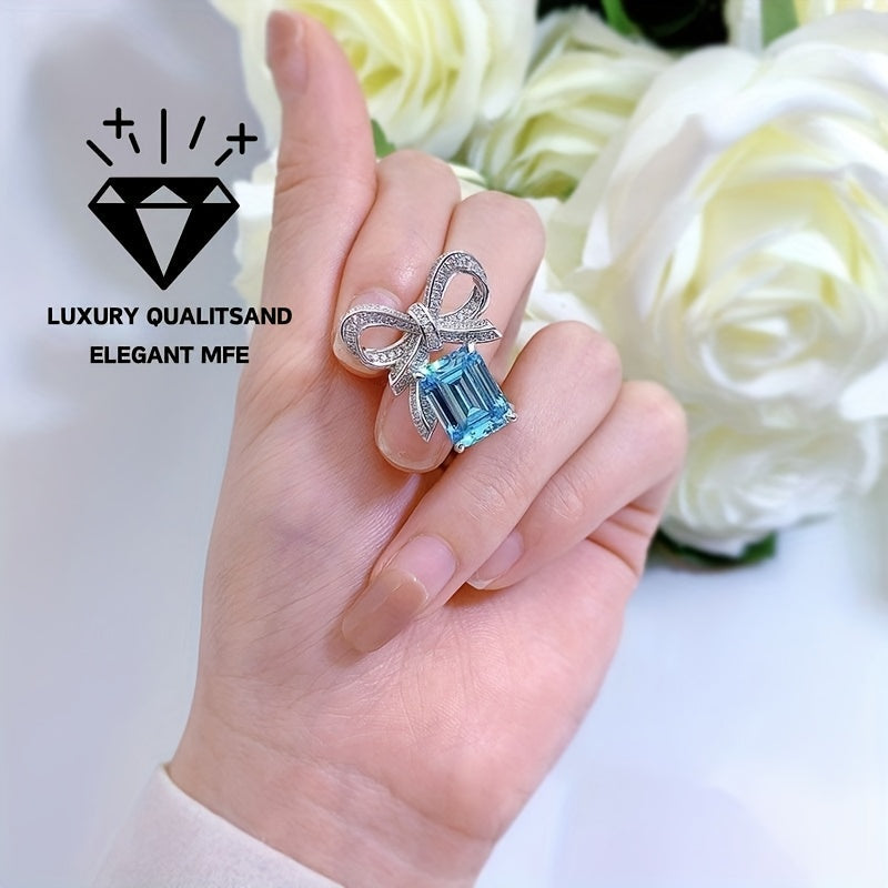 New for 2024, this stunning butterfly ring features a 9*12 aquamarine stone set in high carbon silver. Perfect for a female recipient, this ring comes in a random gift box style.