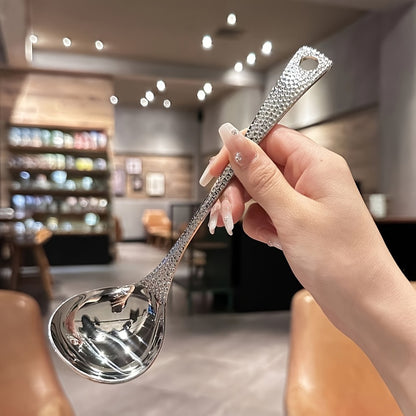 Sleek stainless steel long-handled spoon with leak-proof design, ideal for home and restaurant use.