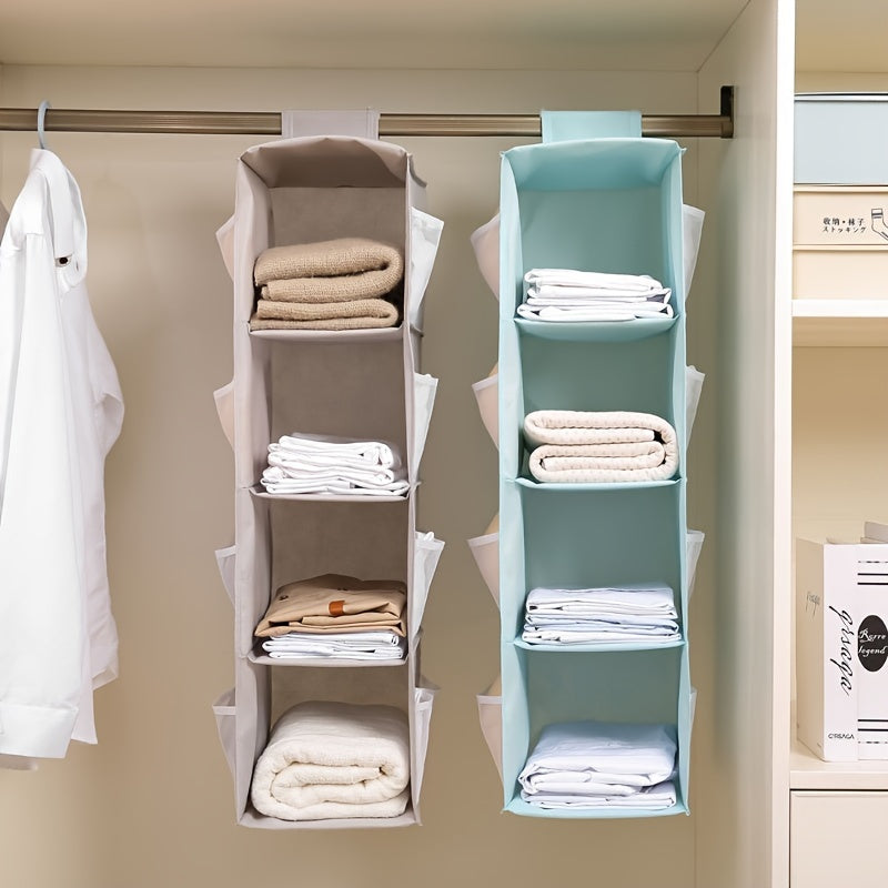 Keep your items organized and easily accessible with this Wardrobe Storage Hanging Bag. It is foldable, washable, and features four layers of storage space for bags, clothes, socks, and more. Save space and maintain neatness in your wardrobe with this