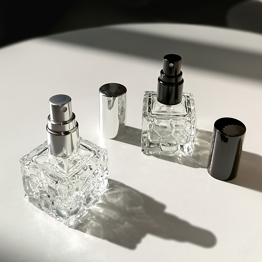 Four stylish square 10ml perfume bottles, perfect for travel, with water cube spray bottles for easy transfer.