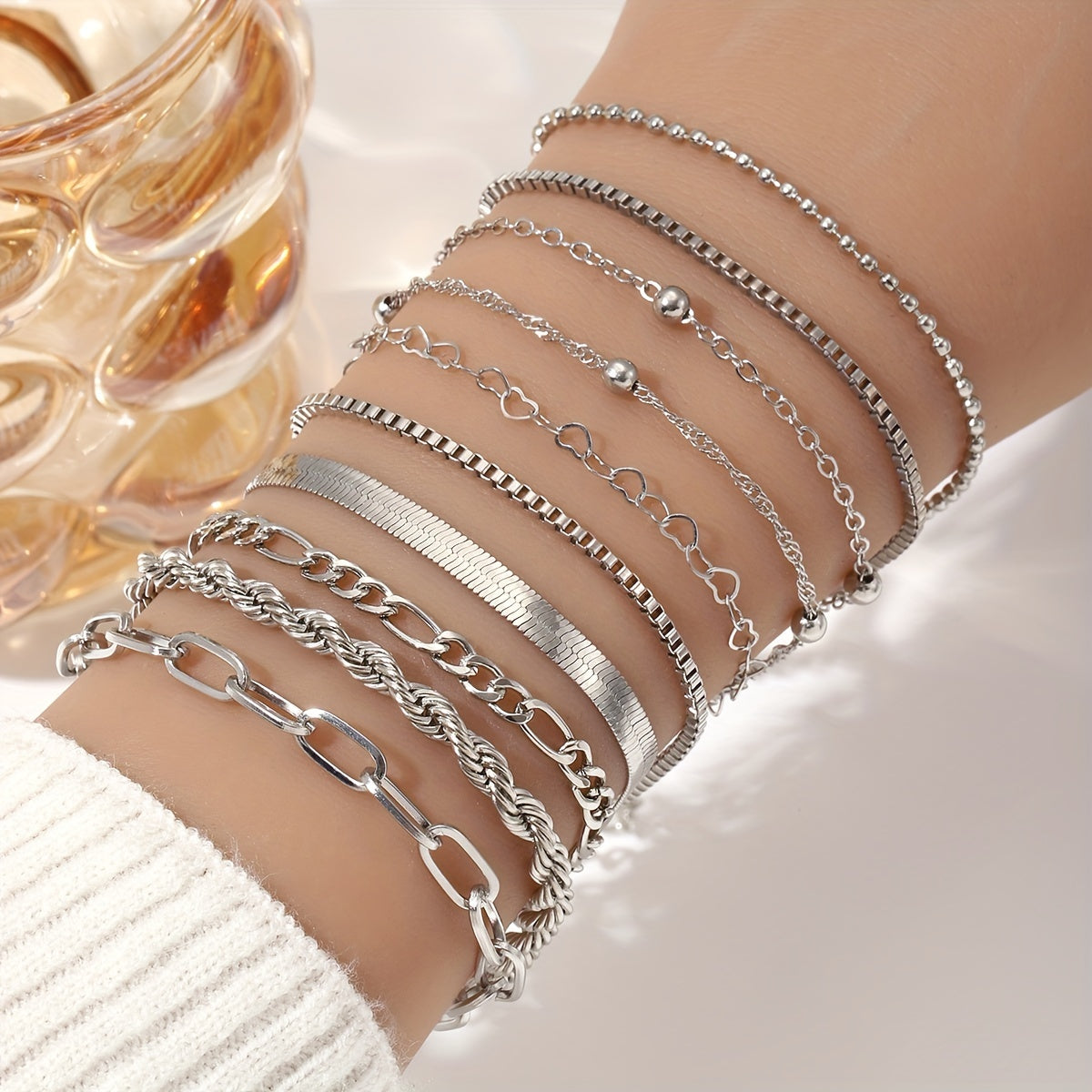 Set of 10 women's stacking bracelets - featuring an elegant twist and snake chain design, made from zinc alloy. Ideal for casual wear or as a gift option.