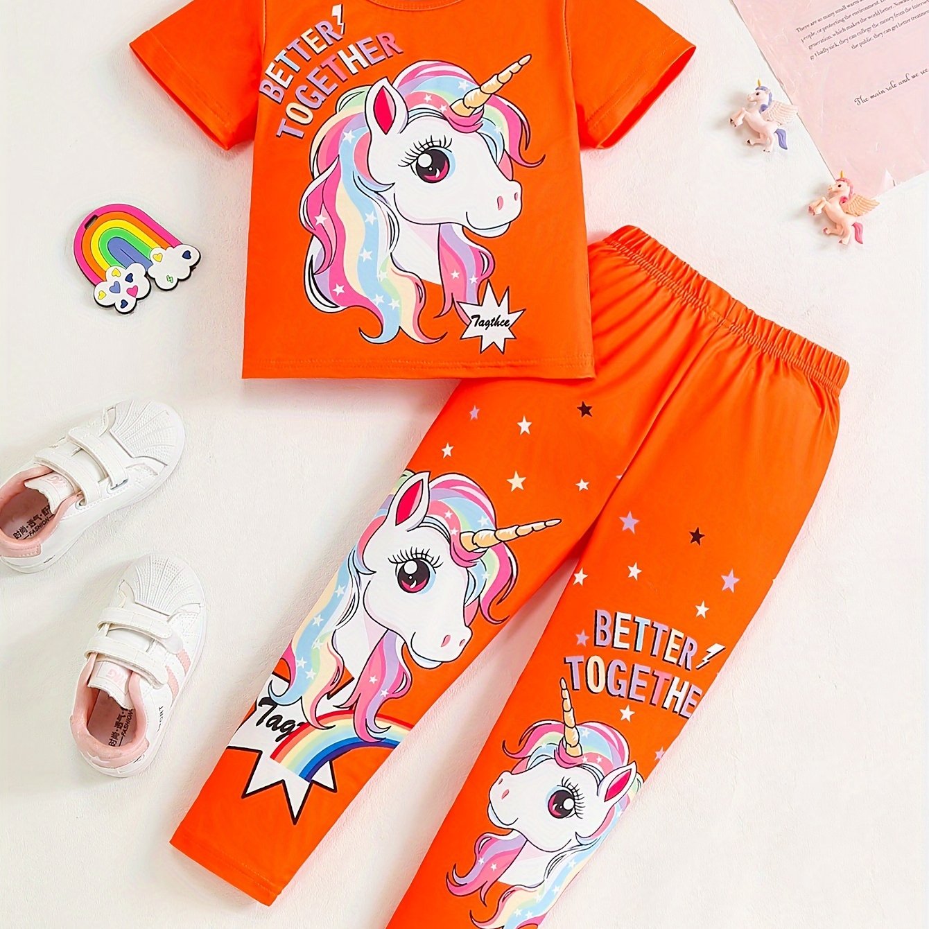 Girls' magical creature graphic t-shirt and jogger pants set. Casual outfit with animal print, regular fit, and medium stretch. Perfect for ages 3+ for outdoor activities.