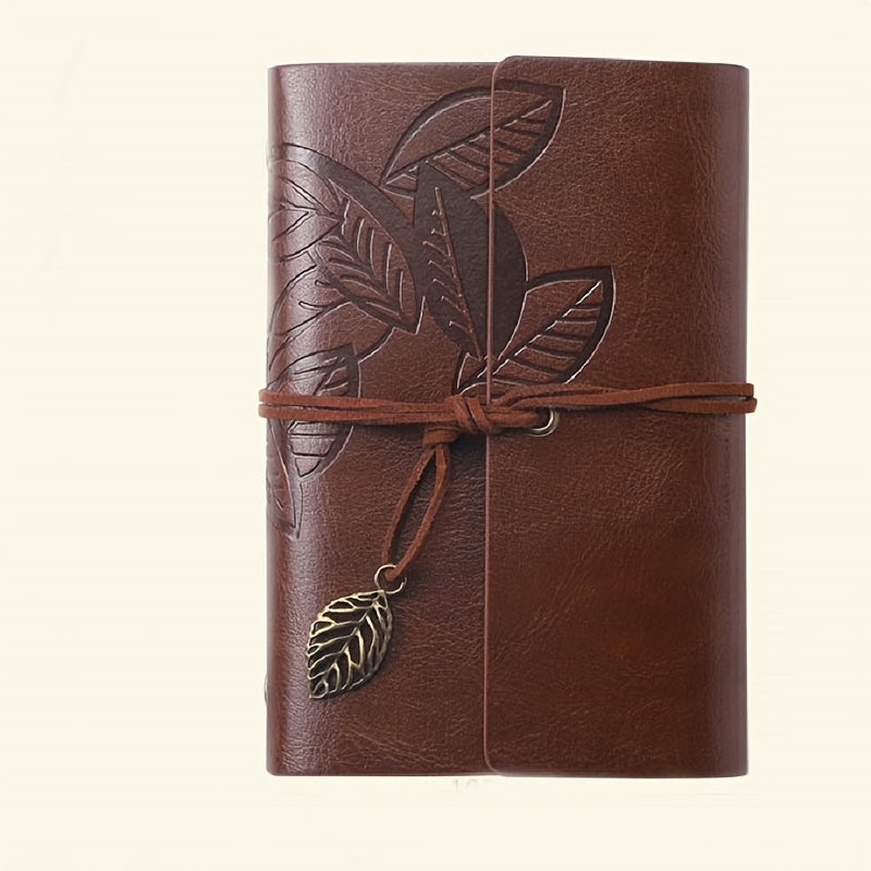 Vintage spiral-bound faux leather notebook with leaf-embossed design and strap closure, available in black, orange, and blue, perfect for students and travelers.