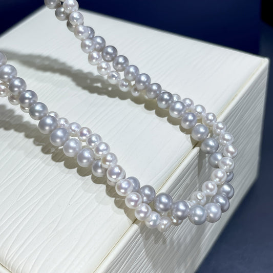 Vintage Double Layer Freshwater Pearl Necklace with a Luxurious Style, perfect for any occasion such as holidays, weddings, vacations, and Thanksgiving. Made with all-natural stones and featuring a Freshwater Pearl Clasp, this necklace is suitable for