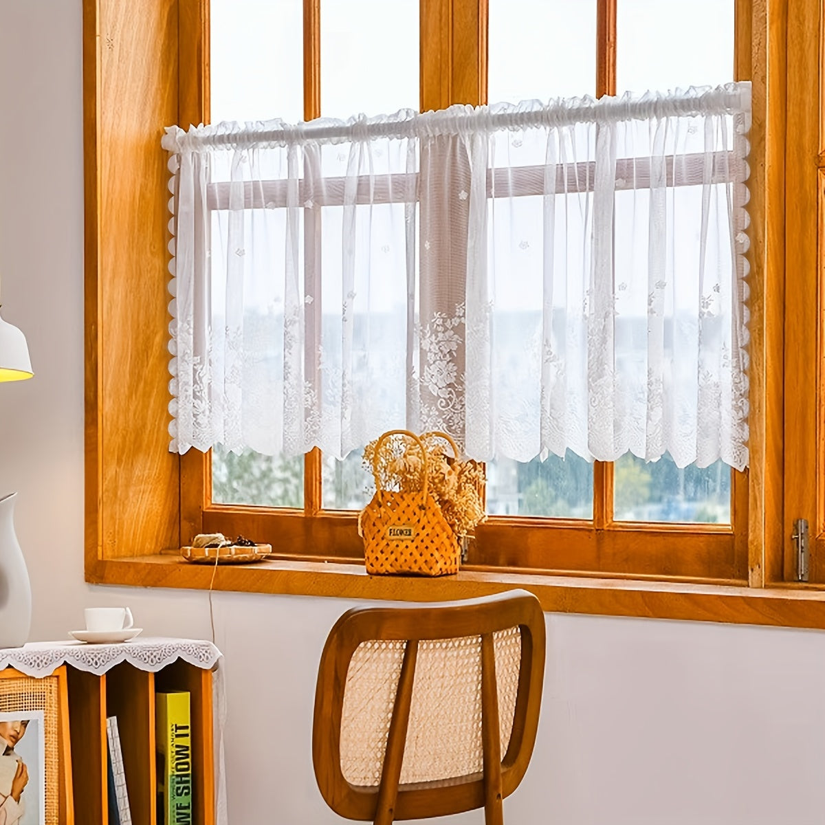 Elevate your space with this elegant black floral lace cafe curtain. Featuring a sweet and simple design, this curtain is made of sheer polyester and has a rod pocket for easy installation. Perfect for adding a touch of sophistication to your kitchen