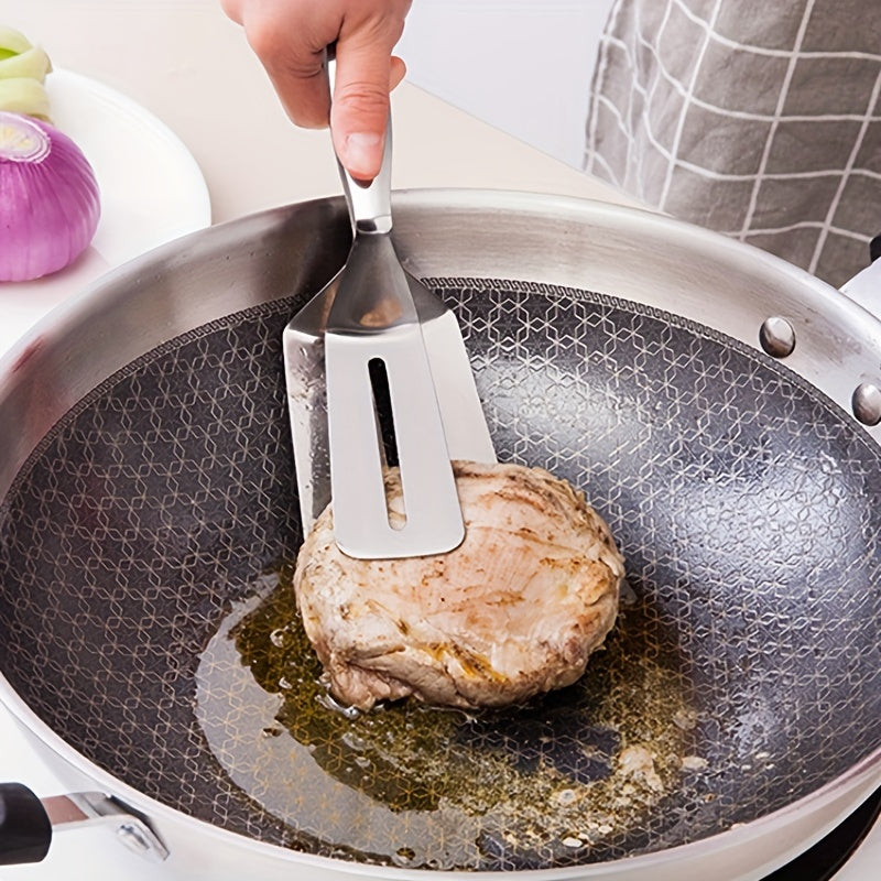 Non-stick steel fish frying spatula for home kitchen.