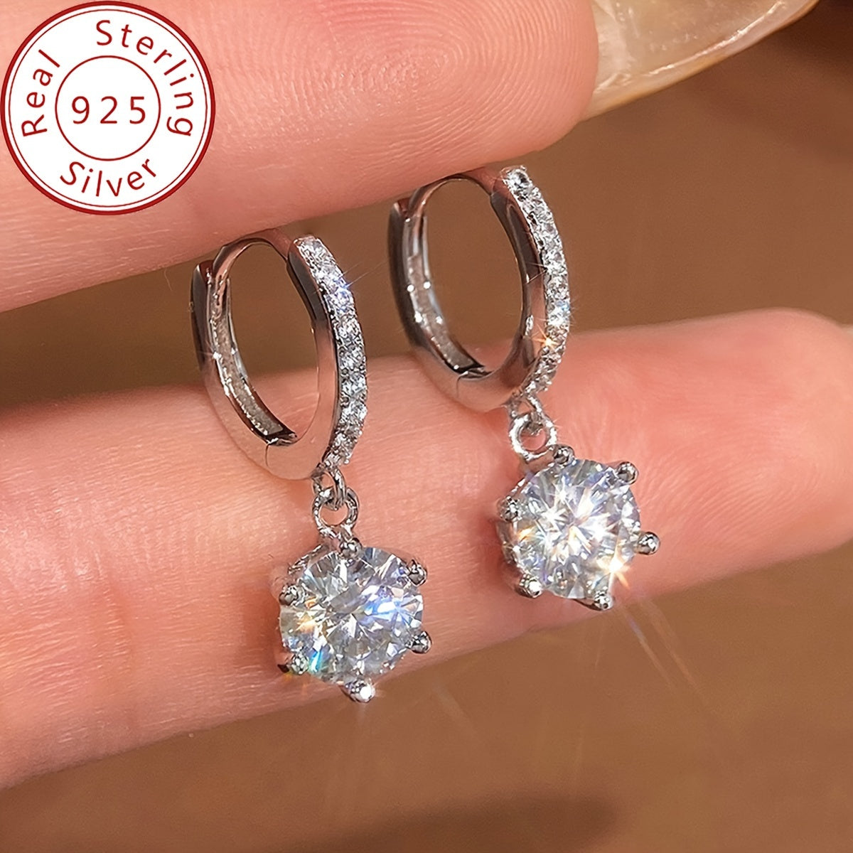 Elegant and luxurious 925 silver earrings designed with six prongs and inlaid with shiny 1ct Moissanite. Perfect for ladies, ideal for special occasions like banquets, anniversaries, or birthdays. A fashionable and delicate accessory weighing 2.6g.