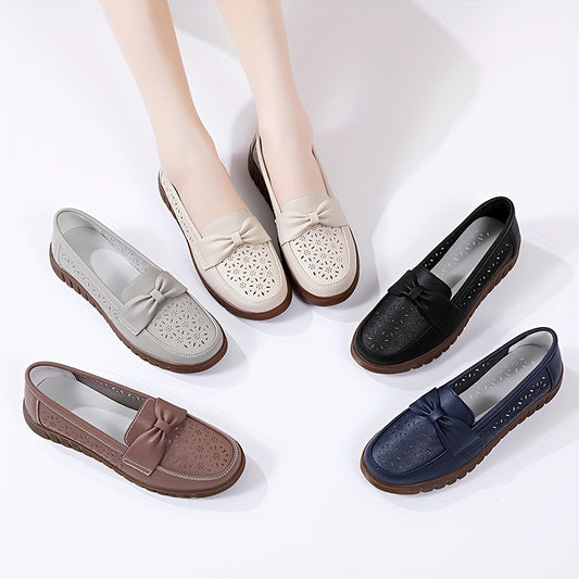 Women's breathable closed toe flat shoes with hollow out design.