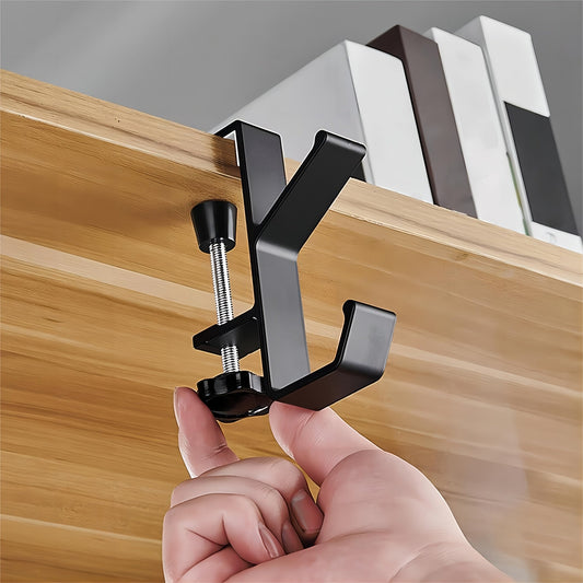 Get your hands on the convenient 1pc Versatile Under-Desk Hook! This adjustable hook has a high-load capacity and is easy to install. It's perfect for hanging bags on your home office desk or school desk table. This portable and practical hook is a