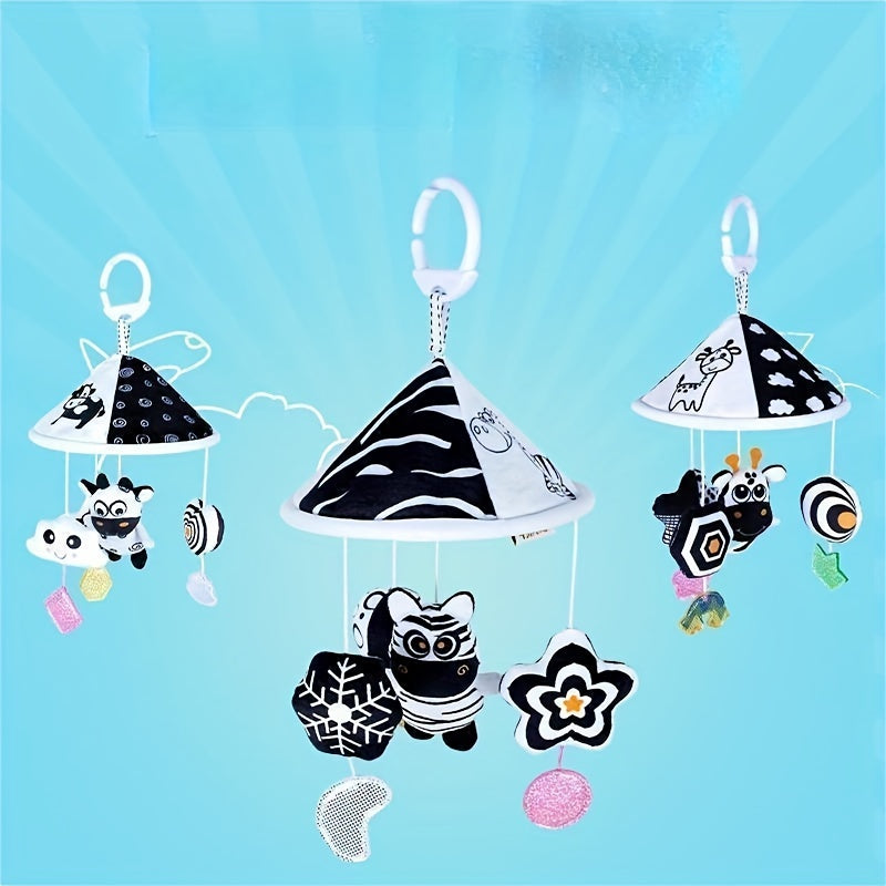 Baby toy car in black and white hanging from the baby trolley, with an umbrella wind chime for early education. The crib bell and stroller hanging umbrella bed bell pendant features black and white animal wind chimes. Additionally, there is a bed hanging