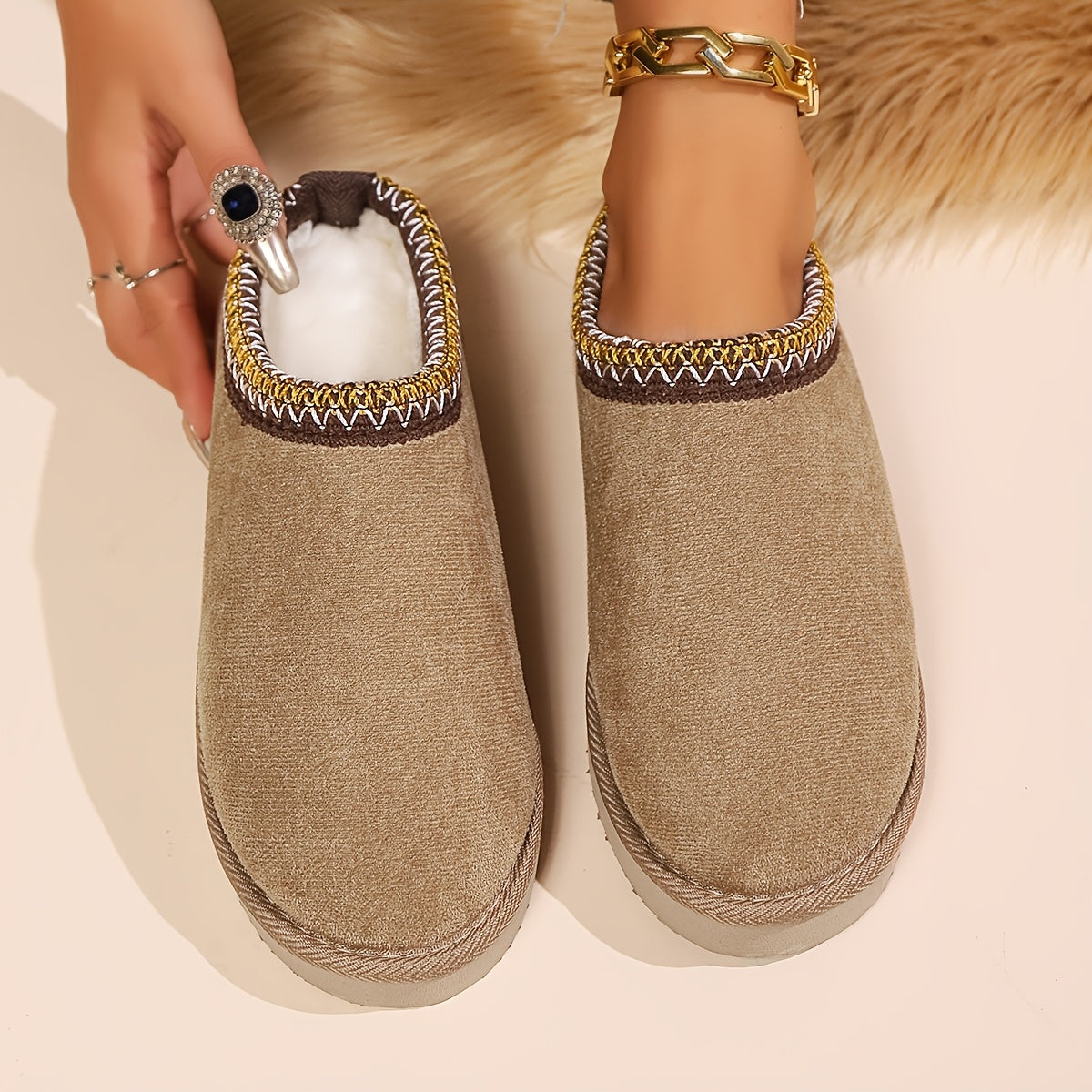 Warm and cozy women's winter slippers with plush lining and anti-slip sole.