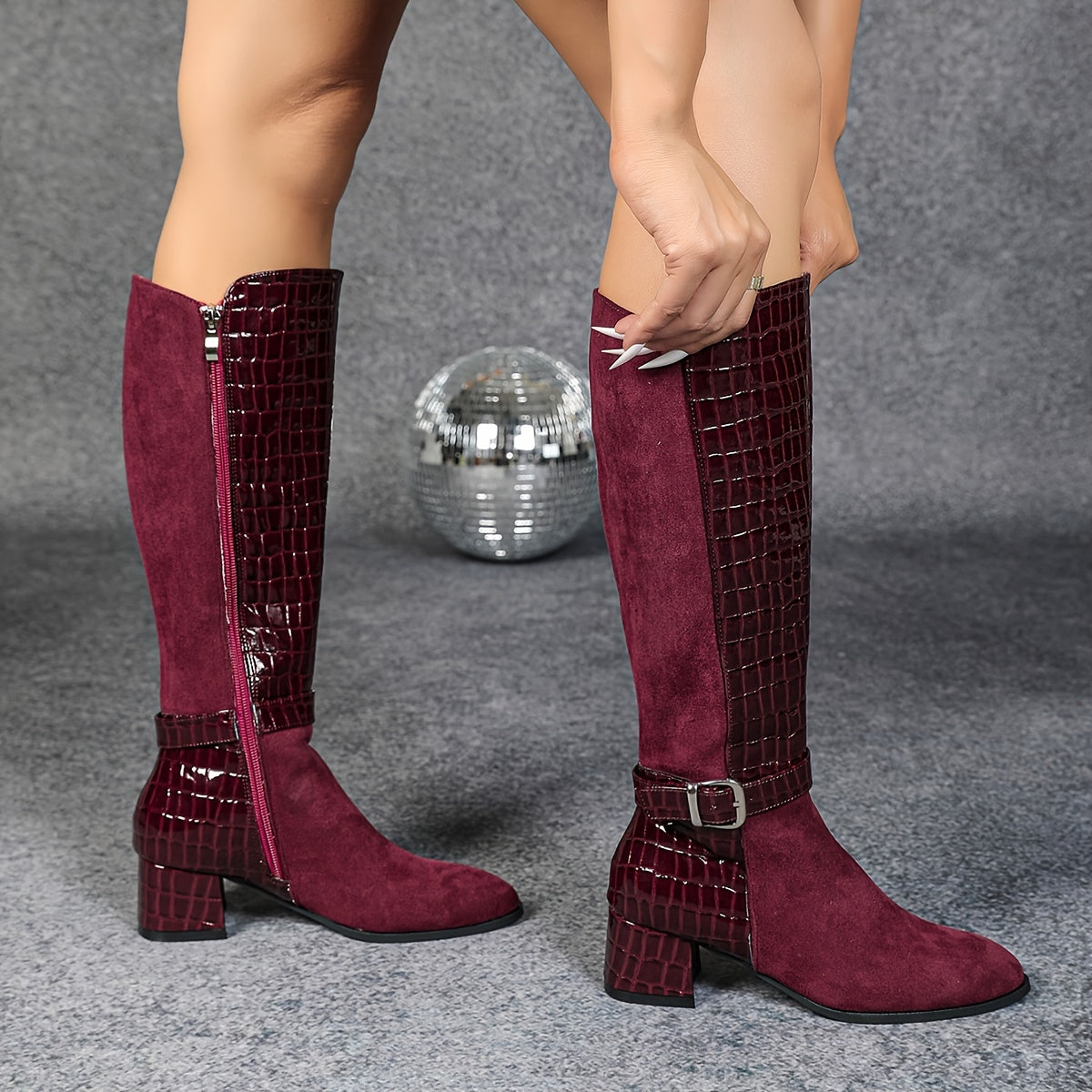 Wine red mid-heeled boots with pointed joints and side zippers, knee-high plush winter boots for a knightly look.