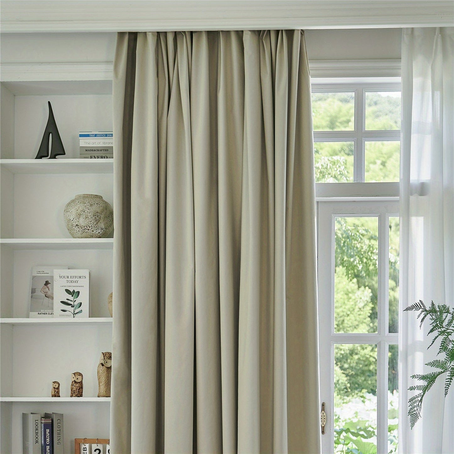 Blackout curtains in black or white color options available for bedroom and living room. These thermal lined curtains are insulated and light blocking, reducing noise in the room. Perfect for use in various rooms including living rooms, bedrooms