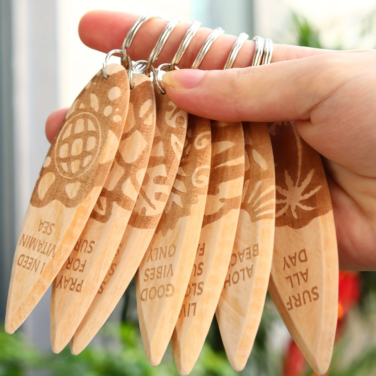 Set of 7 wooden keychains shaped like surfboards, perfect for beach parties or as a fun favor for purses or backpacks. Miniature surfboard pendants that make a great addition to any keychain collection.