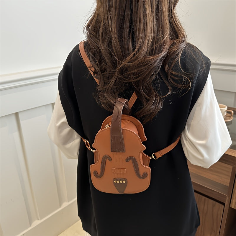 Stylish black/white violin-shaped crossbody bag with adjustable strap, perfect for casual use.