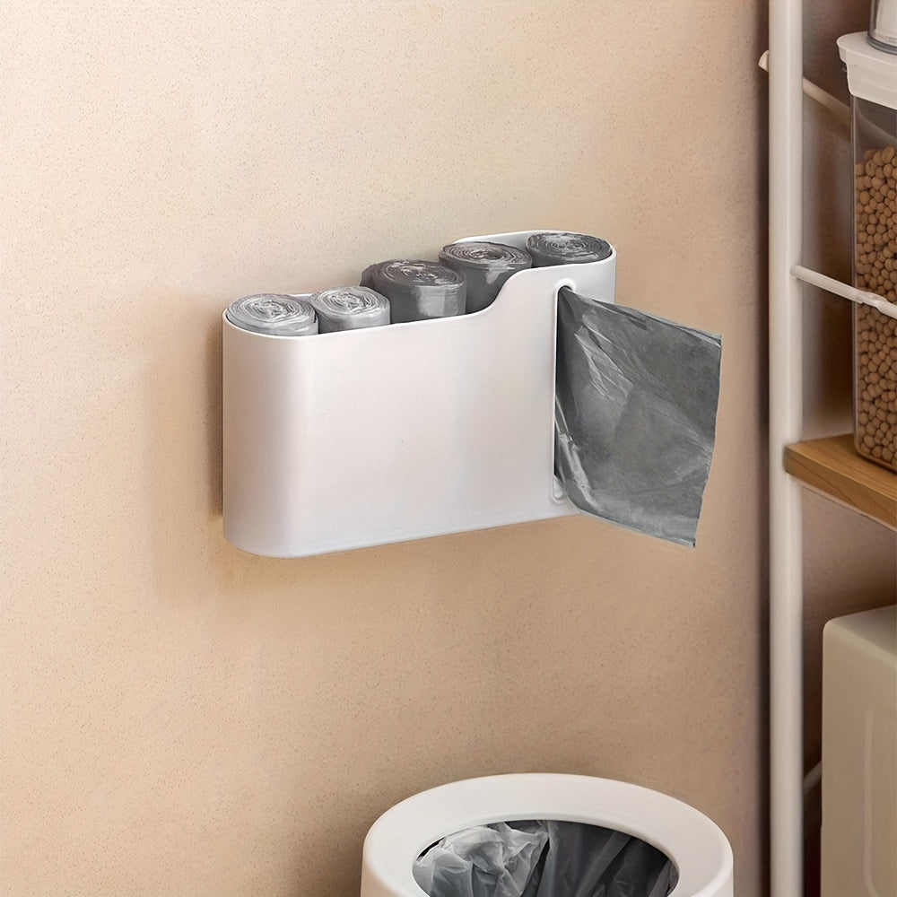 Get organized with the 1pc Plastic Bag Holder! This wall-mounted Garbage Bag Storage Box is a multifunctional Trash Bag Dispenser perfect for storing plastic wrap and roll paper in your kitchen and bathroom. Keep your home tidy with this handy organizer