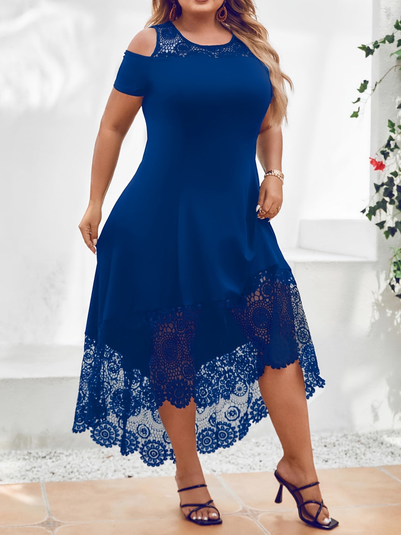 Stylish plus size black dress with white lace panel features off-shoulder design, short sleeves, and asymmetrical hem. Made of medium stretch, machine washable fabric, this dress is ideal