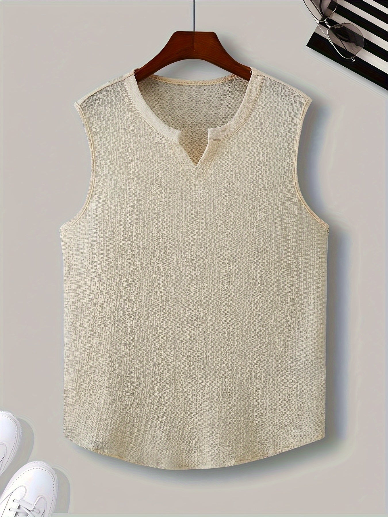 Polyester tank top for men with loose fit and slight stretch, perfect for casual summer outings.