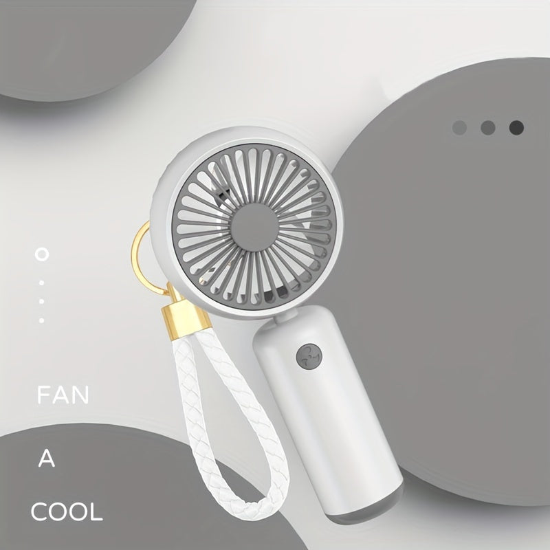 Small handheld portable fan with USB rechargeable battery, three adjustable speeds, and wearable design for use both indoors and outdoors.