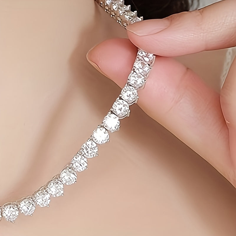 The Moissanite Tennis Necklace by Gems Lady features a 5mm stone set in S925 Sterling Silver with a unique Three-Claw Design. This elegant Clavicle Chain is perfect for all occasions including Engagement, Wedding, Anniversary, Mother's Day, Valentine's