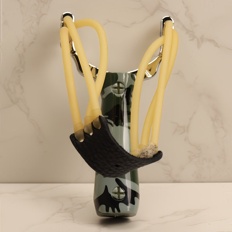 One alloy slingshot with plastic handle in camouflage design, ideal for outdoor shooting with wooden texture and three rubber bands.