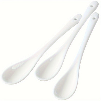 A set of 10 ceramic spoons with a long handle measuring 12.95cm, made of white porcelain for serving coffee, soup, seasoning, and espresso. Perfect for adding an elegant touch to your kitchen and dining essentials.