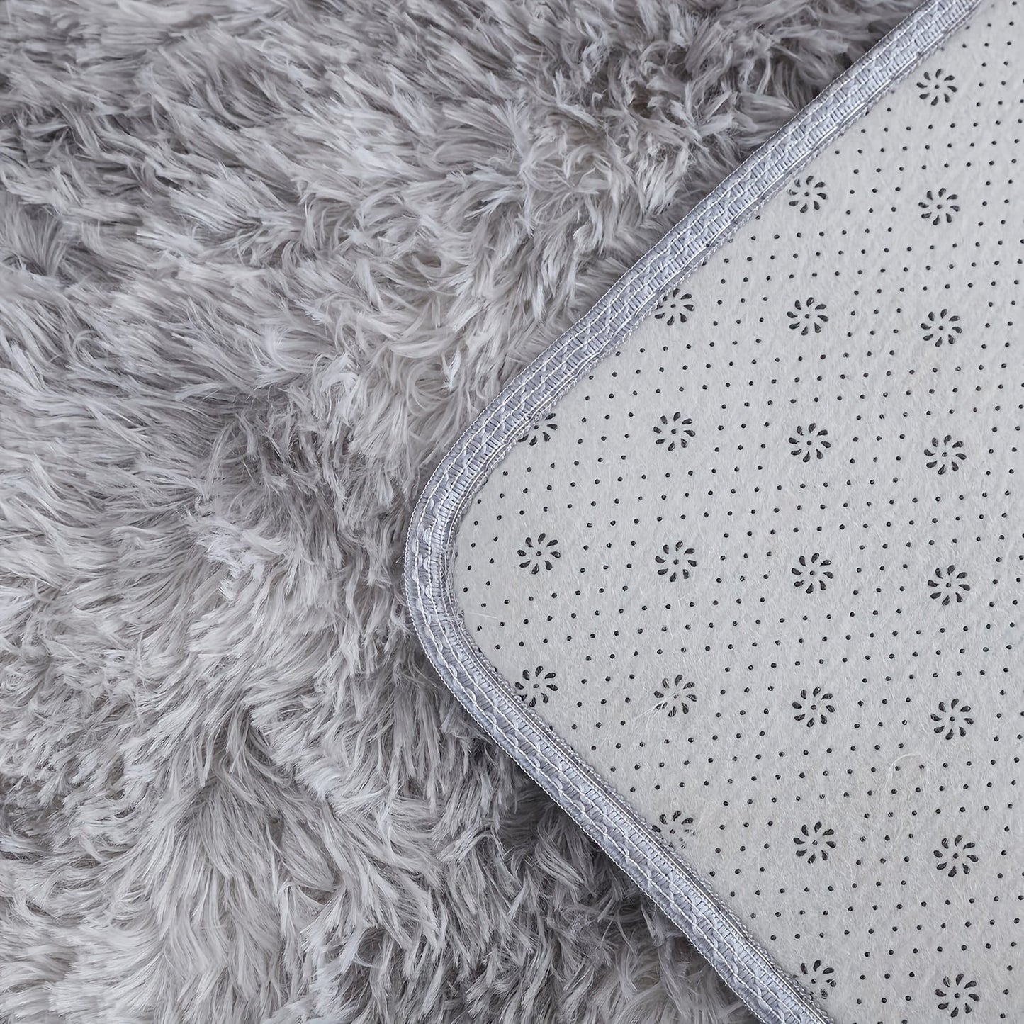 Indulge in the luxurious comfort of our Super Soft Fluffy Area Rug, crafted with non-slip plush polyester fiber for ultimate coziness. Ideal for enhancing the decor in your living room, bedroom, nursery, game room, or dorm. This rug is hand wash only and