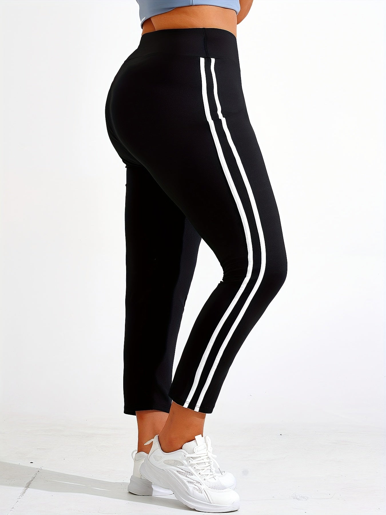 Plus size yoga pants for women, solid color, slimming fit, machine washable, long length, made of stretch polyester and elastane.