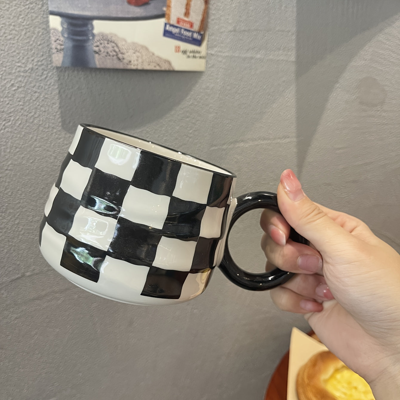 Stylish black and white checkered ceramic coffee mug - Ideal for home or restaurant use.