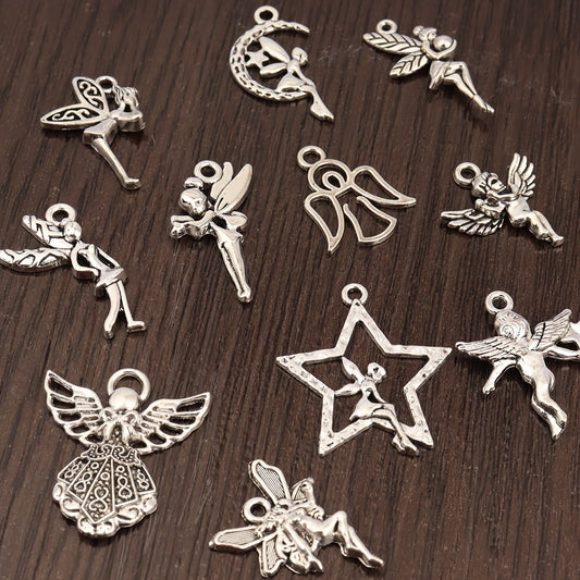 An Assortment of 50+ Vintage Angel Pendants in Gold and Silver for Crafting DIY Jewelry, Accessories, and Decorations.