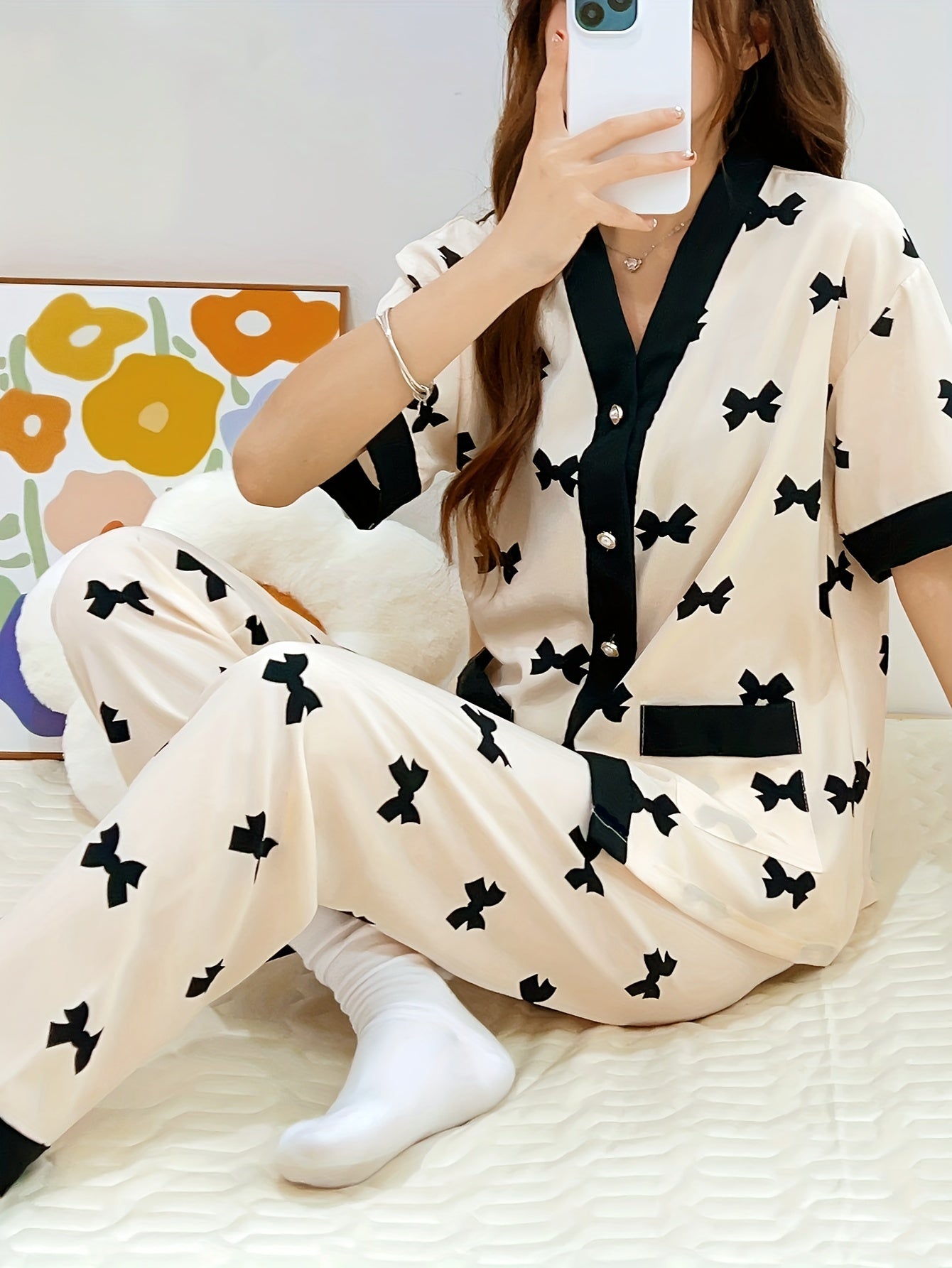 Summery short-sleeved women's pajama suit with sweet V-neck cardigan and thin material perfect for summer.