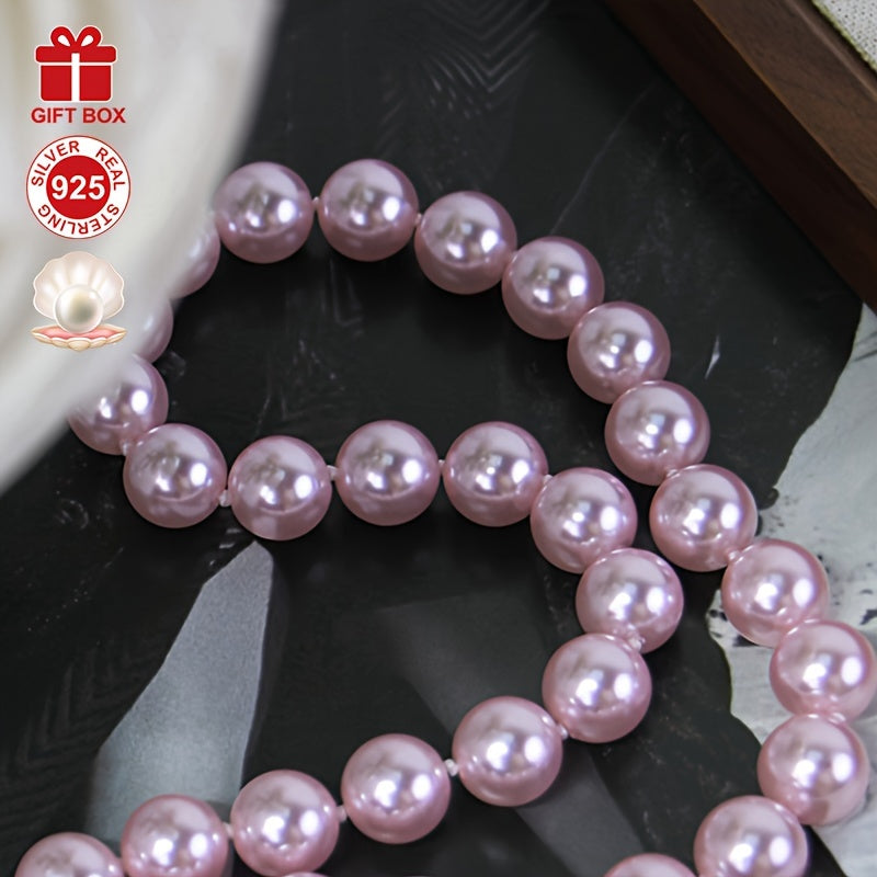 This stunning Cherry Blossom Pink Shell Pearl Necklace is crafted with hypoallergenic 925 Sterling Silver and features a vintage charm clasp. It makes the perfect gift for her and comes beautifully presented in an elegant gift box, making it ideal for