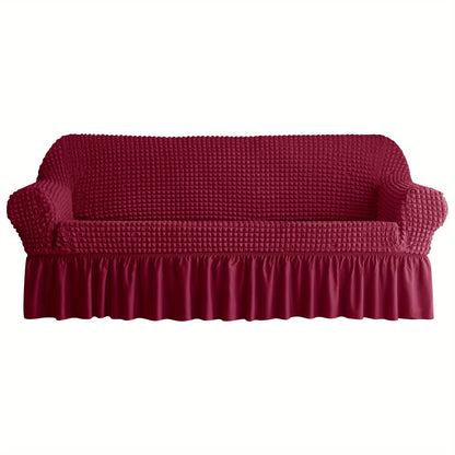 Non-slip elastic sofa cover with skirt for home decor.