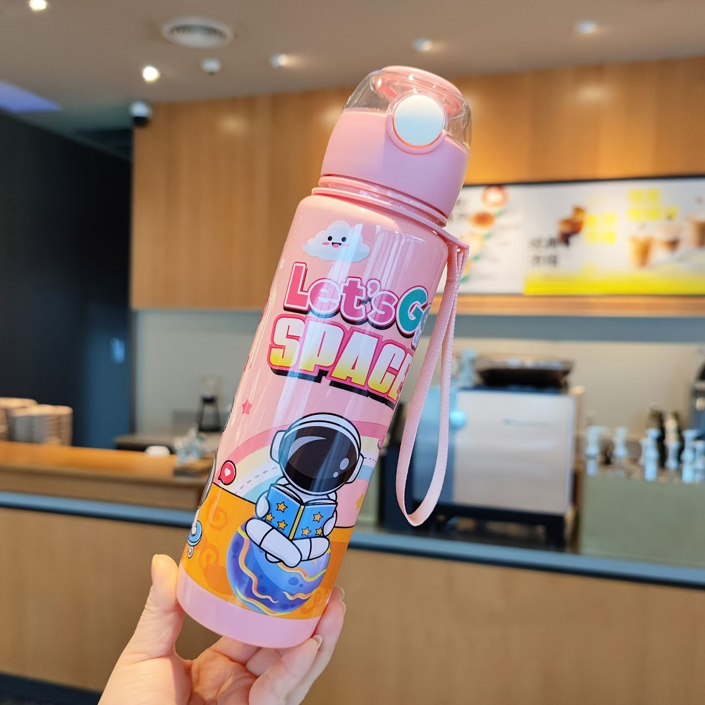 Leak-proof and space-themed 700ml water bottle made from BPA-free, high-temperature resistant PC material, ideal for outdoor activities. A perfect holiday gift.