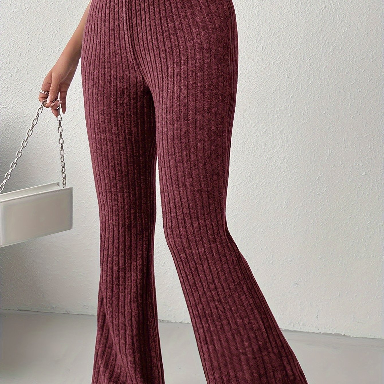 Women's elegant solid color knit flare pants made of a soft and comfortable polyester blend, perfect for all seasons, with a fabric weight of 210g/m².