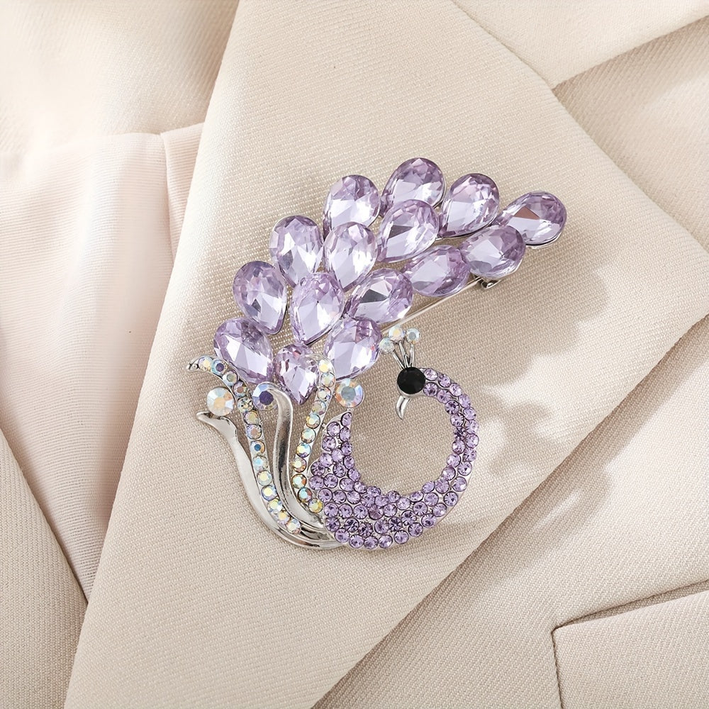 A beautiful purple crystal brooch pin, featuring an elegant and unique design with rhinestones. This fashion accessory is made from high-quality alloy material and showcases a stunning peacock design, perfect for women who appreciate stylish and