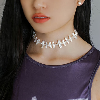 This stunning necklace is inspired by elegant French Baroque style, featuring natural freshwater pearls. The unique clavicle chain is perfect for women to wear on vacations and parties. It comes packaged in a gift box. Please note that natural pearls may