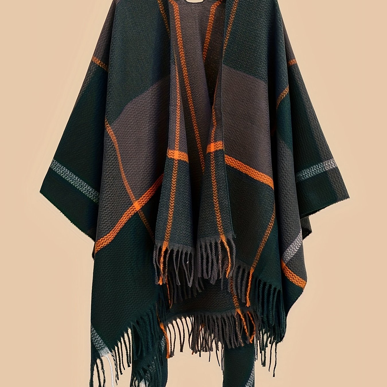 Stylish plus size shawl cardigan with tassels for fall/winter parties features v-neck, asymmetrical hem, and geometric pattern.