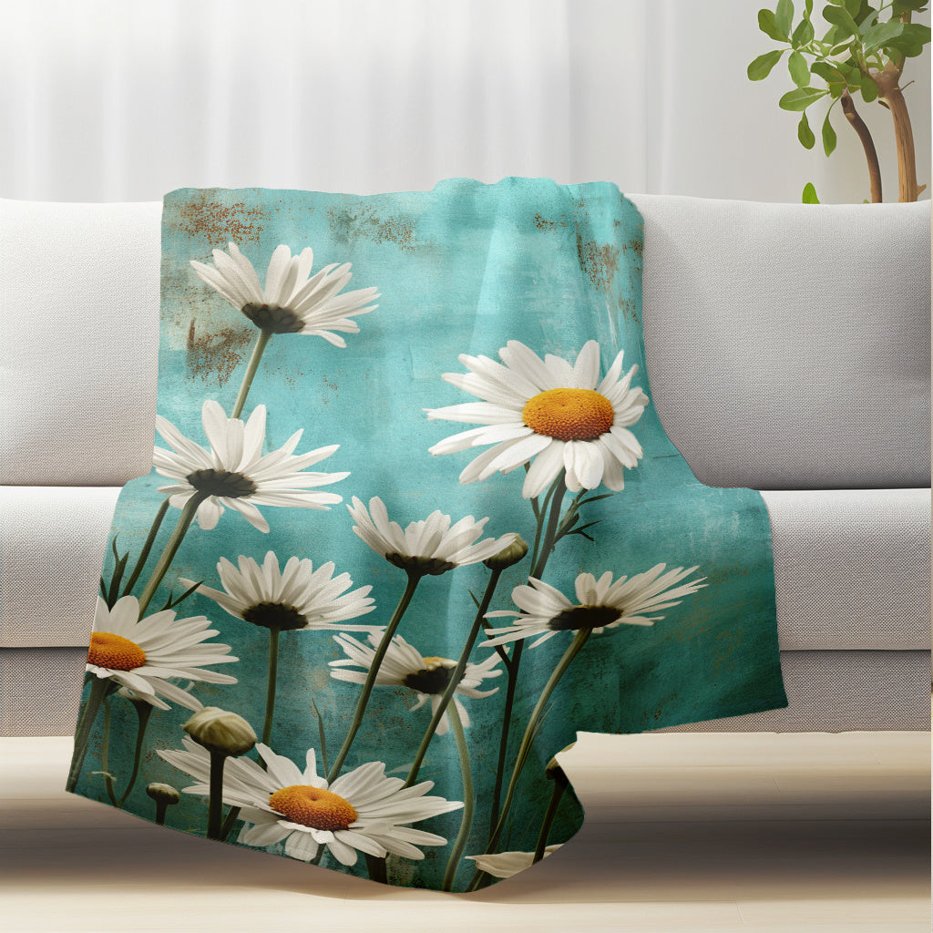 Soft and cozy Flannel Fleece Throw Blanket featuring a beautiful White Daisy Floral Pattern. This lightweight, all-season blanket is made of knitted polyester, making it perfect for use at home or while traveling. It is washable and can be used for