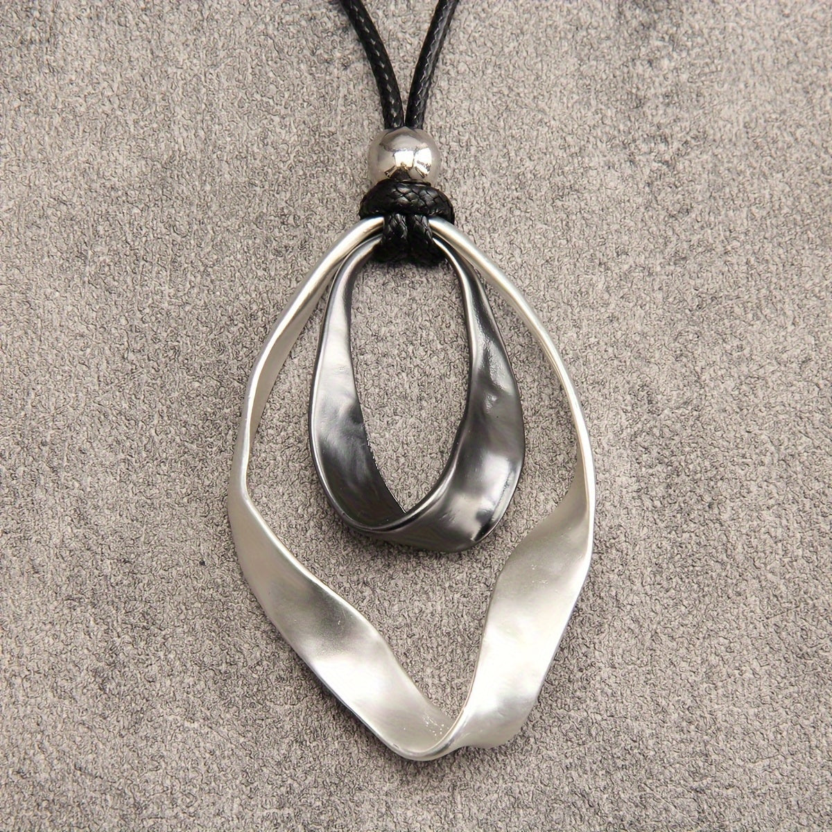 Stylish Twisted Teardrop Pendant Necklace for Women, made with Alloy featuring a Wide Edge Design. Includes a Simple Black Cord Long Chain, Perfect Romantic Gift for your Girlfriend. A Statement Jewelry Piece.